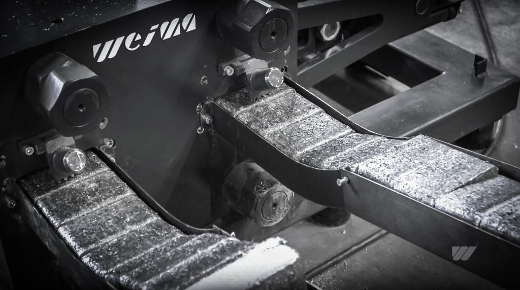 metal briquettes discharge from conveyor