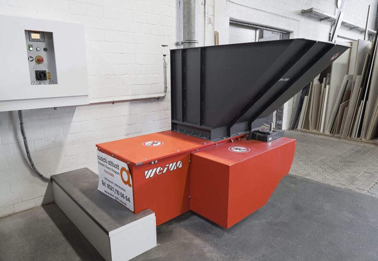 an orange and gray WEIMA shredder with a flared hopper
