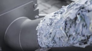 Pellets from labels are pushed out of the machine