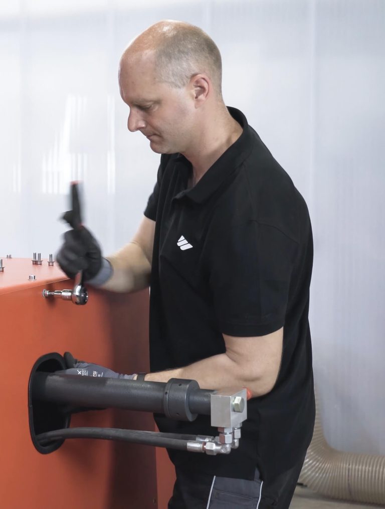 WEIMA service technician works maintenance on WEIMA shredder