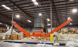WEIMA WLK 18 shredder discharges shredded paper on two conveyor belts