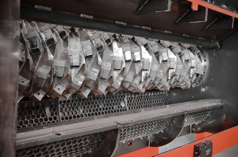 Sieve swivels downwards