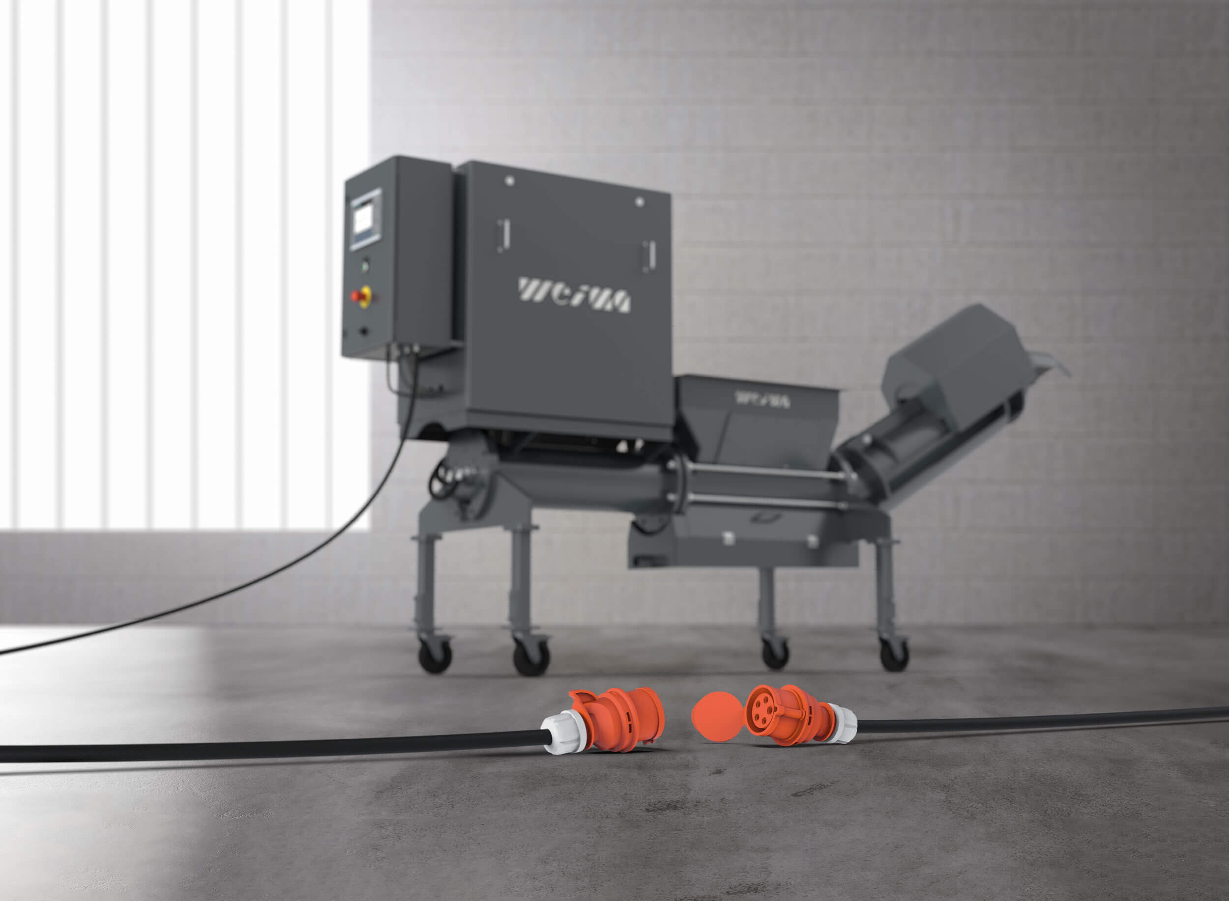 Vor der PUEHLER C.200 liegt ein einzelnes Starkstromkabel, mit welchem die Entwässerungs-Presse angeschlossen werden muss. Sie kann direkt an die CNC-Maschine angeschlossen werden.