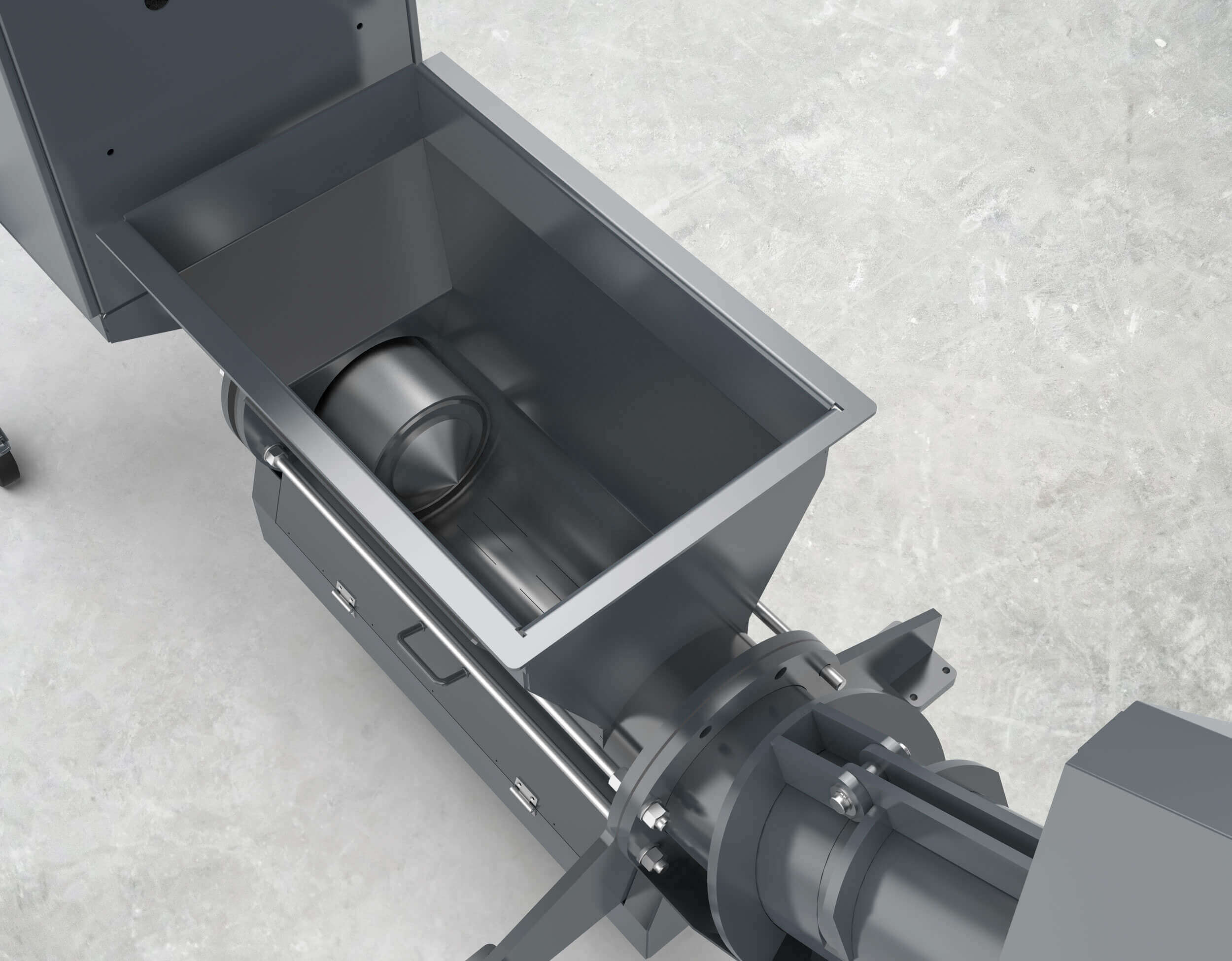 Blick in den Trichter. Darin ist der Pressstempel im Presskanal und der Verzicht auf eine Förderschnecke zu sehen.