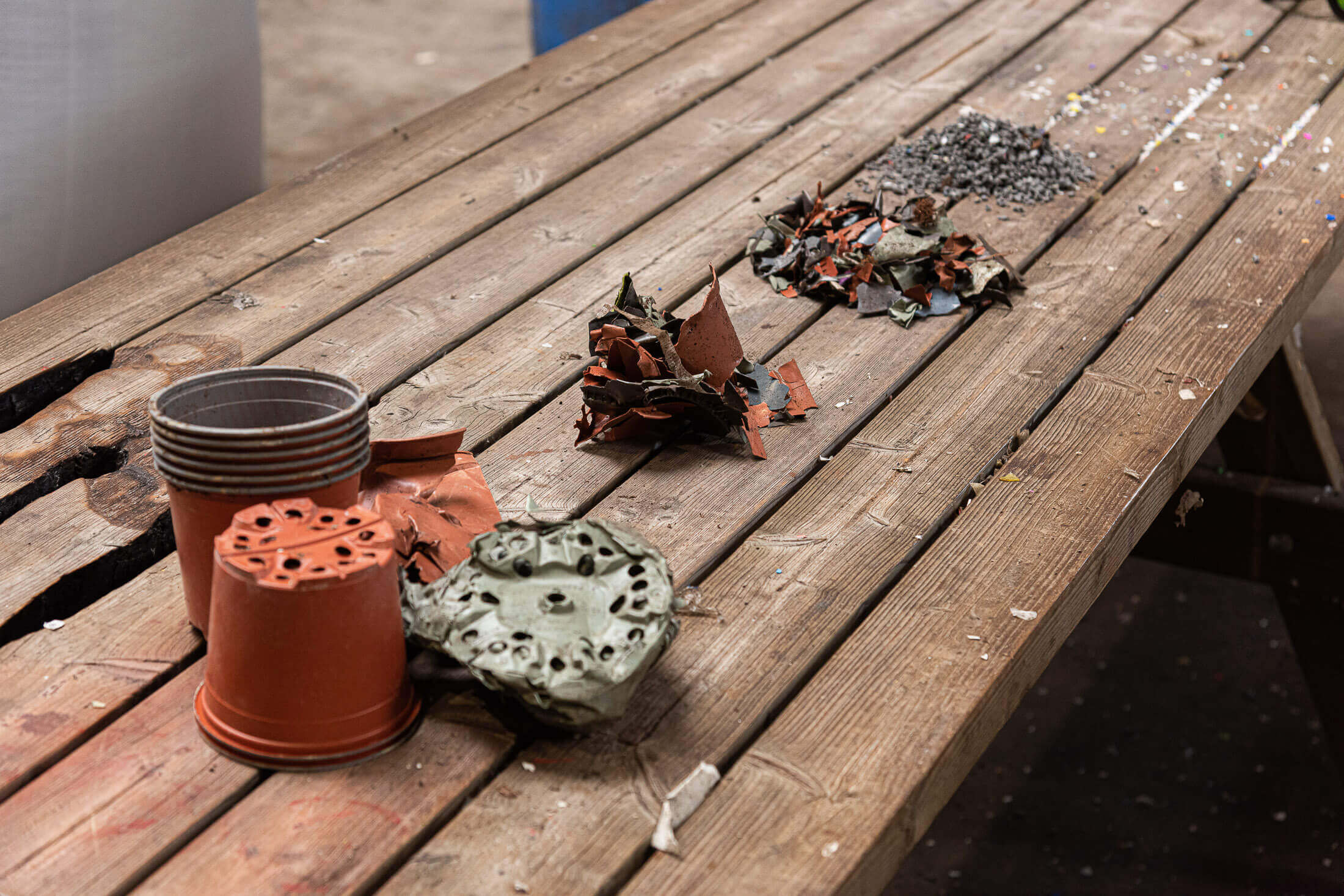 Different material states of the flower pot recycling process from raw material to granules