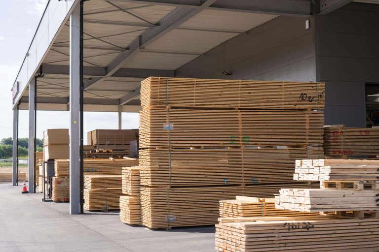 Outdoor area of Bropack Bronner Packmittel GmbH with fuel resources such as disposable pallets and waste wood.