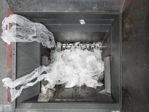 View into the cutting room of a WEIMA plastic shredder that shreds transparent LDPE film with a rotor