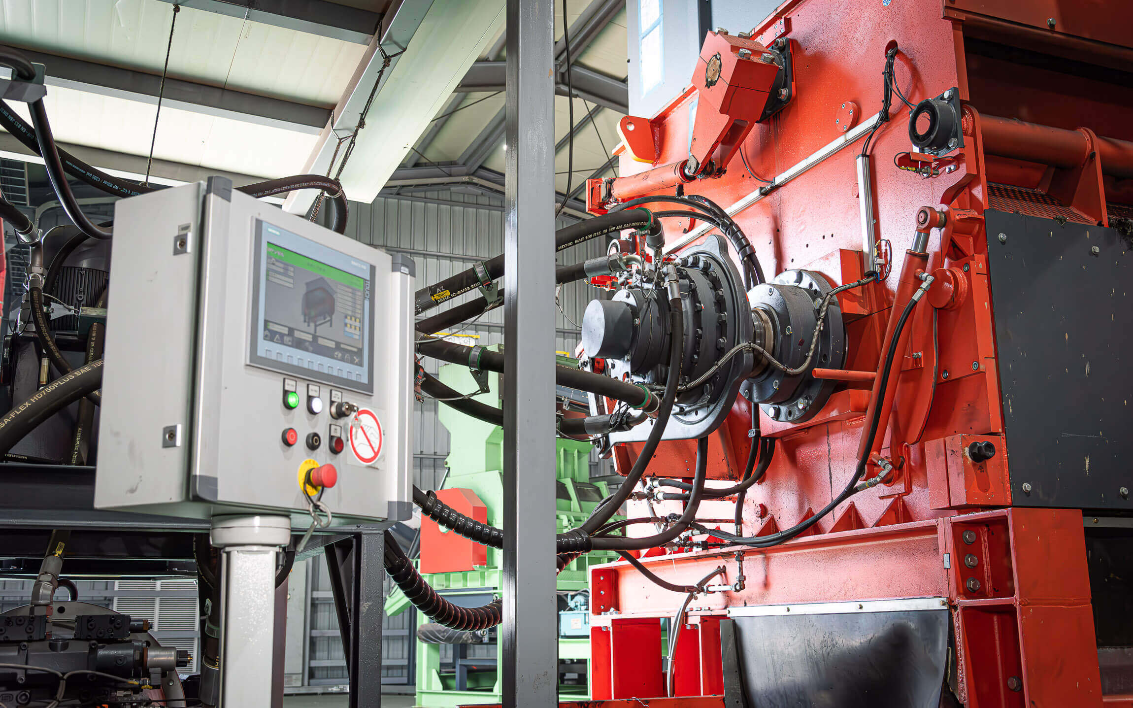 WEIMA waste shredder with powerful hydraulic drive, next to a control panel