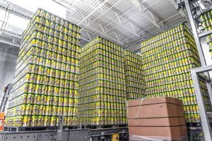 Bales of beer cans being loaded.