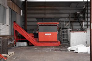 A WEIMA s7.20 single-shaft shredder in a hall on the Remondis premises in Staffanstorp