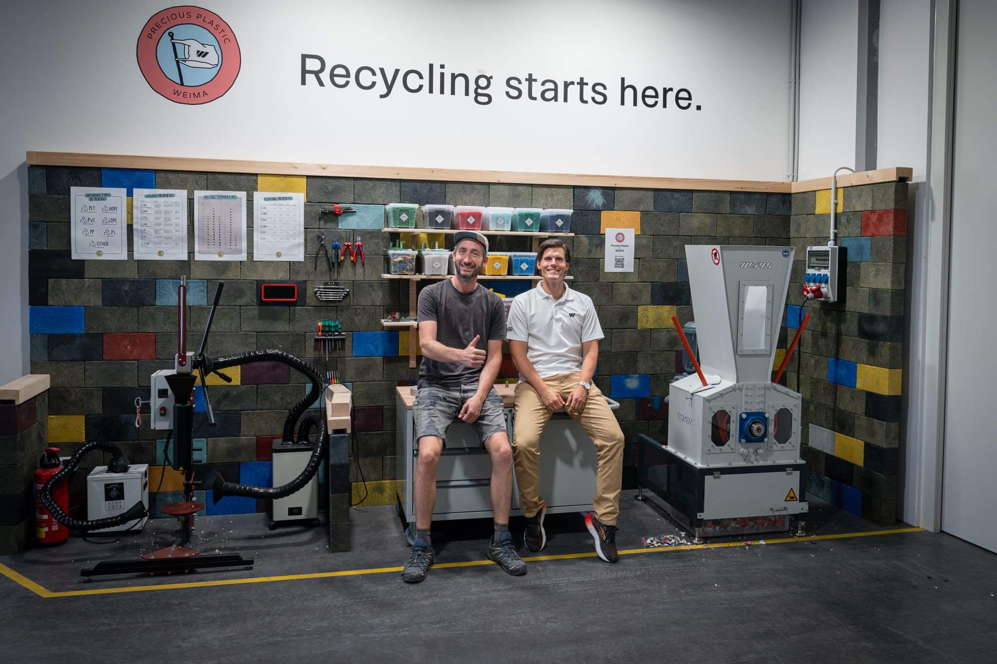 Precious Plastic Workshop at WEIMA with 2 people in front of machines