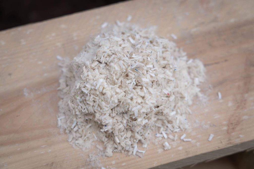 Small cardboard cuttings from beverage cartons