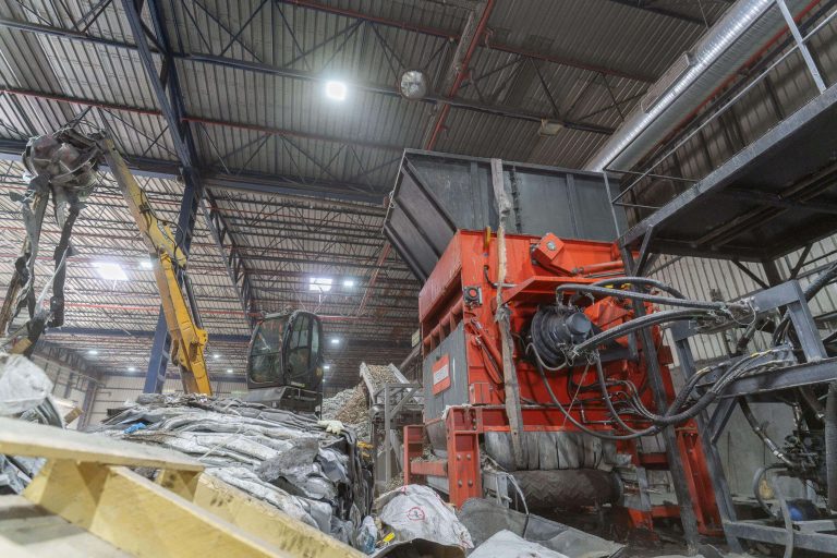 Large shredder shreds waste