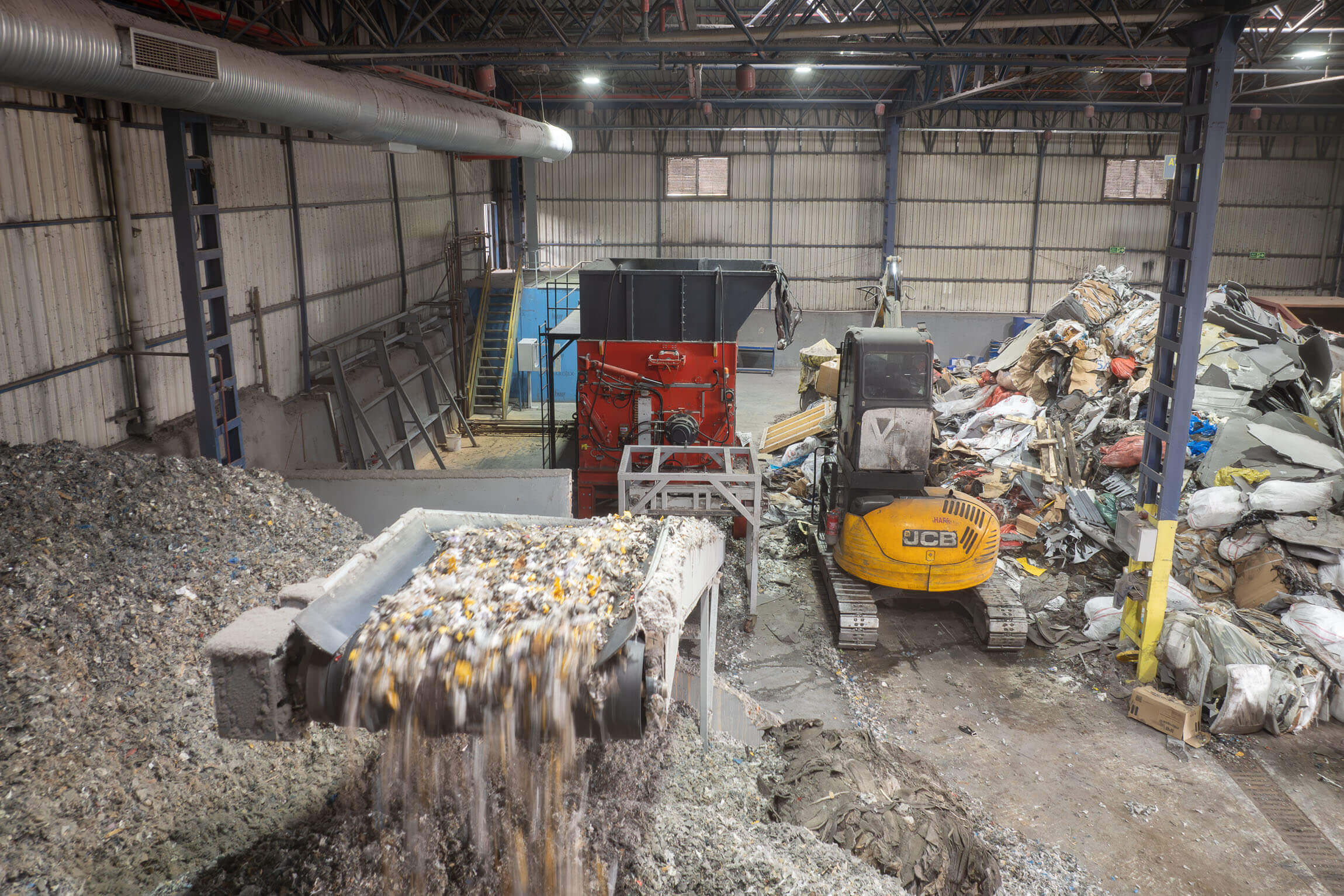 Processed waste transported on a conveyor belt