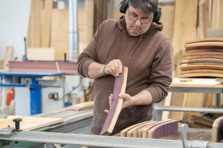 The carpenter inspects and selects the individual parts of the barrel.